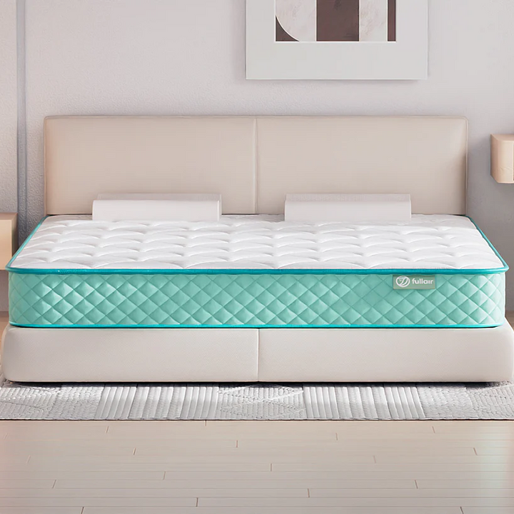 Mattress with a visible brand logo in a bedroom setting